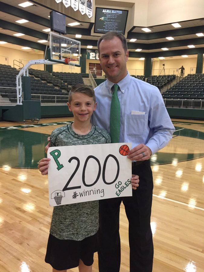 Coach Ellis celebrates his 200th career win with his son.