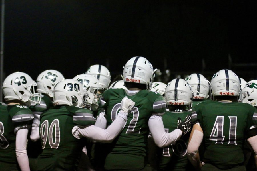 Prosper teammates stand together on the sideline in a game against The Colony Cougars on Friday, October 27th.