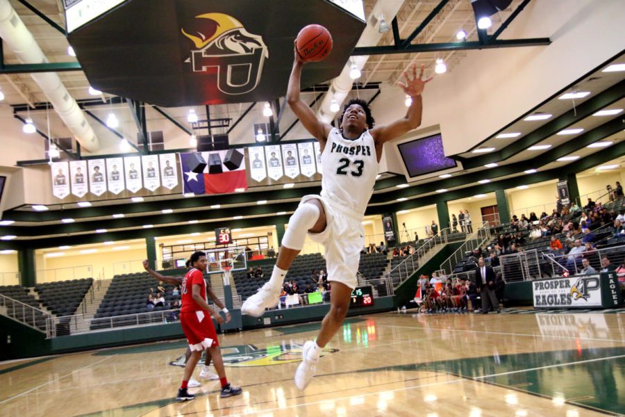 Zach Wrightsil (23) goes up for the dunk in a game against Carrollton Creekview. Wrightsil scored 27 points Friday to contribute to the victory against Little Elm.