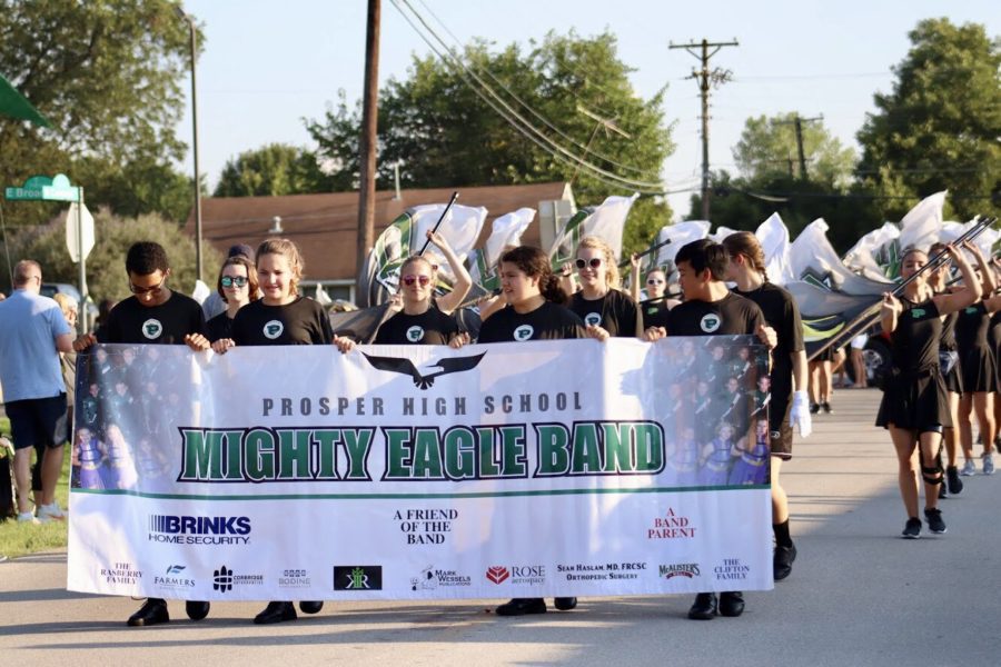 The Mighty Eagle Band walks the streets during the 2018 parade. This years event on Wednesday is set to begin at 5:00 p.m. Its just kind of a glimpse of what we do here at Prosper High School, cheer coach Lyndsey Hamlin said. We start lining cars up at 1 p.m. tomorrow and school floats start lining up between 1 and 2:30 p.m.