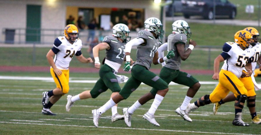 During a defensive play, Cody Gallegos, Joshua Graham and Ananias Mayes (left to right) sprint to stop McKinney from advancing. The McKinnney players featured are Will Bolin, Devin Vasquez and Spencer Morrow (left to right). The play occurred in the first quarter before the game delayed due to lightning.