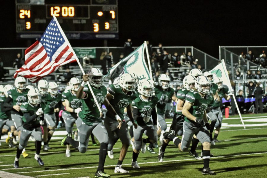 Varsity senior Dylan Harrison, No. 20 in the center, helps lead his team into Eagle Stadium. Harrison will be playing in the last game at Eagle Stadium, starting at 7 p.m. Friday when Prosper takes on Plano West. His father, Jeff Harrison, played in the first. Its bitter-sweet, Mr. Harrison said of he and his sons relationship to the venue. Its pretty cool because I played the first game on that field, and hes playing the last game on it.