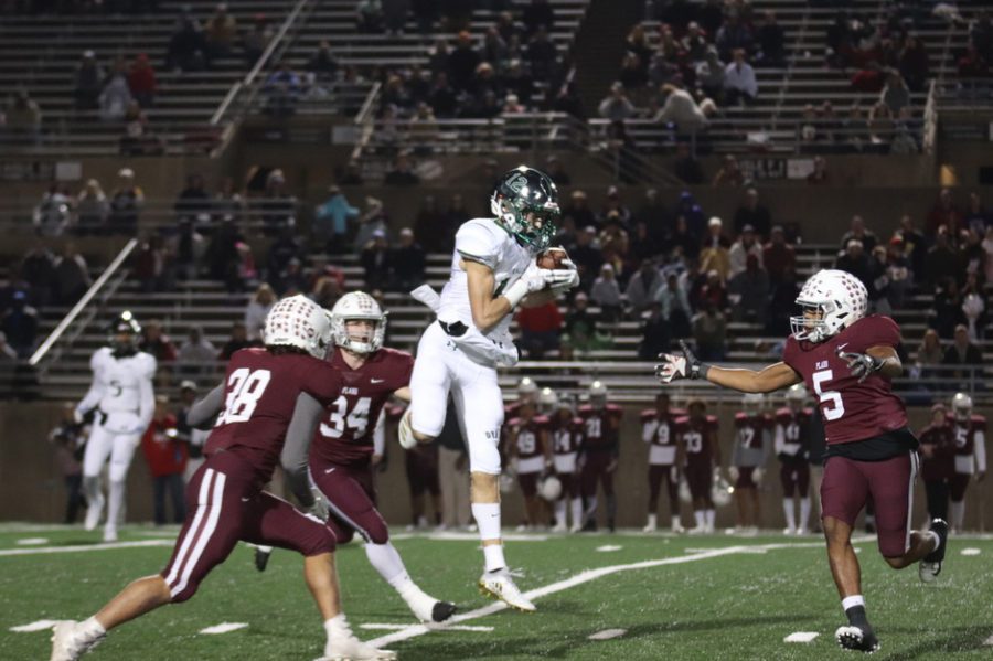 Junior Hayden Metcalf makes a leaping catch over multiple Plano defenders. Metcalf finished with four receptions for 69 yards in Prospers 43-35 win. This win knocked Plano out of the playoff race. 