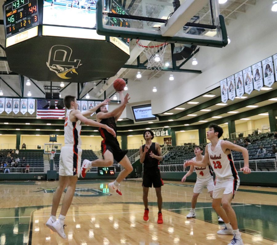A Frisco Wakeland player tries to block Lake Highlands shot. They played in this years Sewell Prosper ISD Tournament Friday, Nov. 30. Lake Highland won against Wakeland, 62-60. 