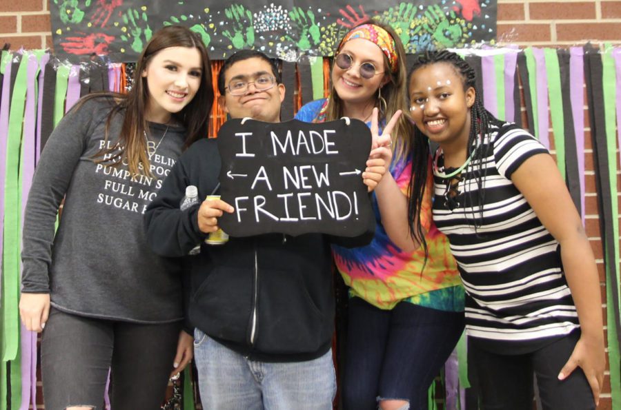 Blakely Spears, Jacob Tejada, Shannon Kuria and Emily Whitmire take time together in the photo booth at the Best Buddies Match Party in October. One of the newest organizations at the school is Best Buddies, which is a group focused on creating friendships for students with disabilities. The group is open to all high school students.
I hope students come with an open heart and an open mind, Gomez said. Be willing to take the time to form friendships.