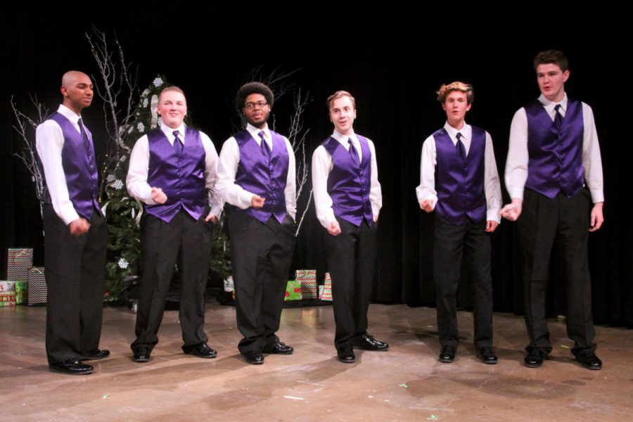 The boys in Show Choir snap their fingers as they sing Little Saint Nick by the Beach Boys. The group will perform the piece again this Friday, Dec 14. The most important thing I would say about show choir is that it would be the most entertaining class you could be in, junior Austin Mann said. 