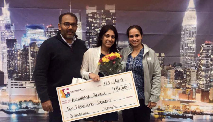 Senior Arya George stands with her parents after winning a $10,000 scholarship. “I did not think I would win,” George said. “They had six scholarships in total. There was one $1,000, four $5,000, and then the $10,000 scholarship. They called the $10,000, and said it was me. I freaked out. It was a dream.” The scholarships were given out at the ACE awards, which was a 15 week mentorship based program. 