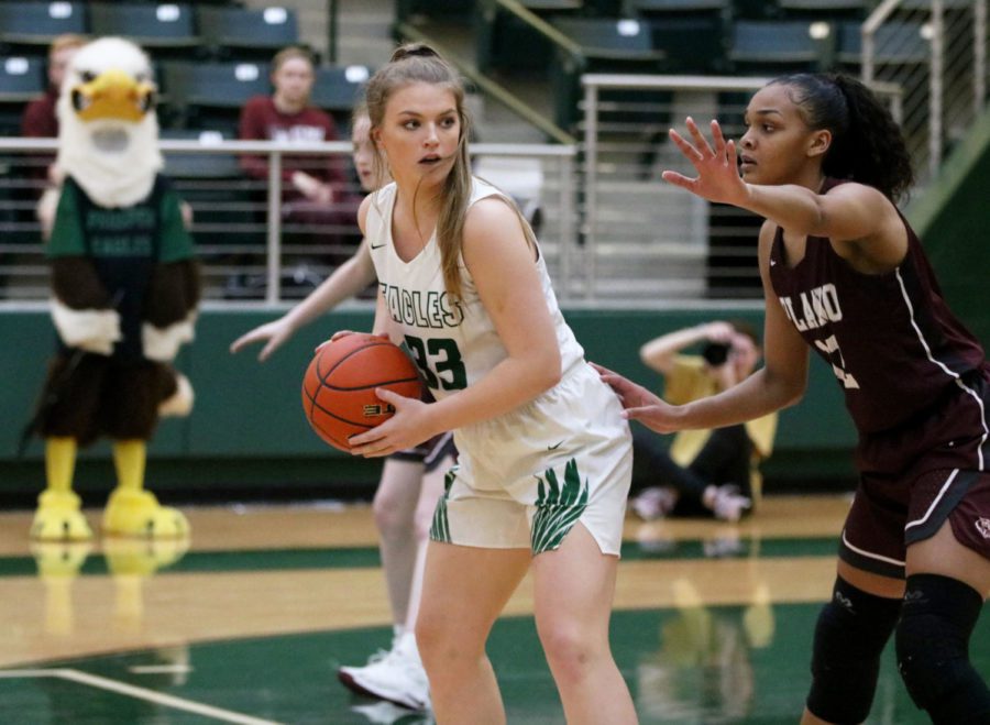 Senior Mackenzie Verhulst No. 33 looks to pass the ball to fellow teammate Jordyn Oliver, No. 3. The girls beat Plano Senior 63-62 after going into overtime. The team plays Rowlett Tuesday, Feb. 12 at Princeton High School at 6:30 p.m.