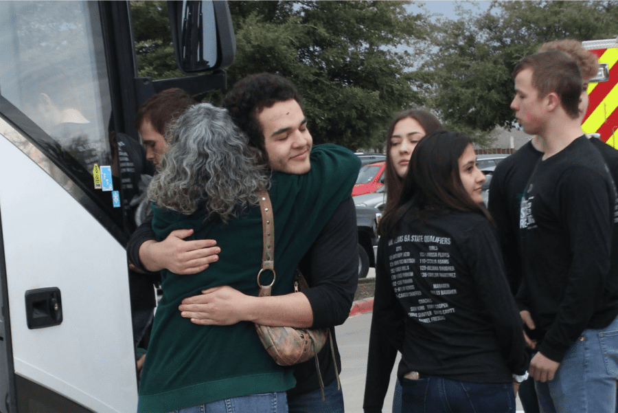 Junior varsity wrestler Josiah Squires hugs his mom, Dalana Squires, goodbye as he leaves for the state championship. The tournament will take place at Cypress, Texas, in the Berry Center. “Last year was my first year here, and it was also our last year at 5A,” coach Sion King said. “Our kids were adjusting to being one of the better teams at 5A and now we jumped another level.”