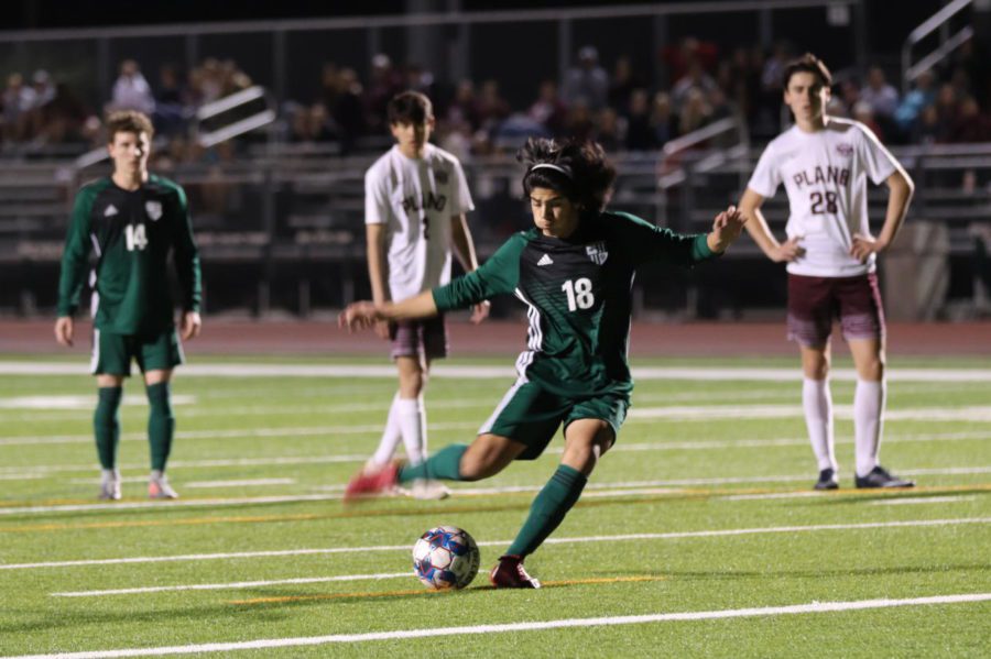 Junior Osbaldo Loredo shoots a penalty kick against Plano on Friday night. The boys lost 3-2, which dropped them to fourth in district. They play Rowlett on Thursday,  March 28. 
