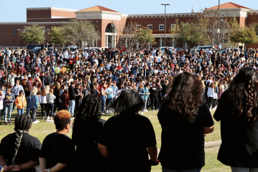 Students stand outside to observe the Shattered Dreams demonstration. The demonstration included a scene of a car accident between two students. Shattered Dreams is a program intended to raise awareness for drunk driving.