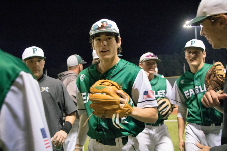 Chase+Pendley%2C+No.+12%2C+celebrates+with+teammates+while+heading+into+the+dugout.+Pendley+batted+seventh+and+played+second+base+in+Prospers+9-0+win+against+Plano+East.