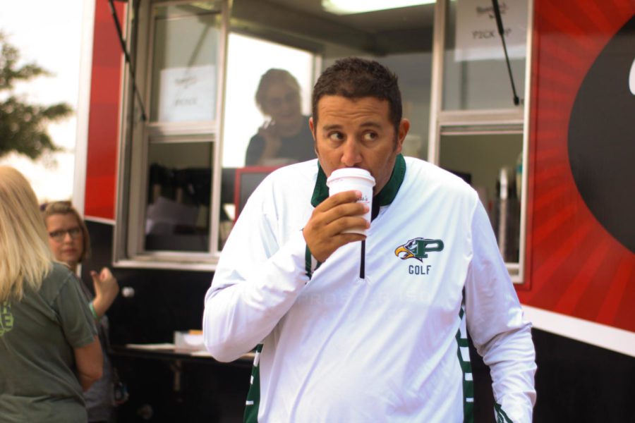 Coach Ryan Salinas, takes the first sip from his Honeylus coffee, which the school administration provided for teachers. The Honeylus truck came to the high school today, Friday, Oct. 4. I cannot wait to enjoy this coffee, counselor Robert Storey said before class.