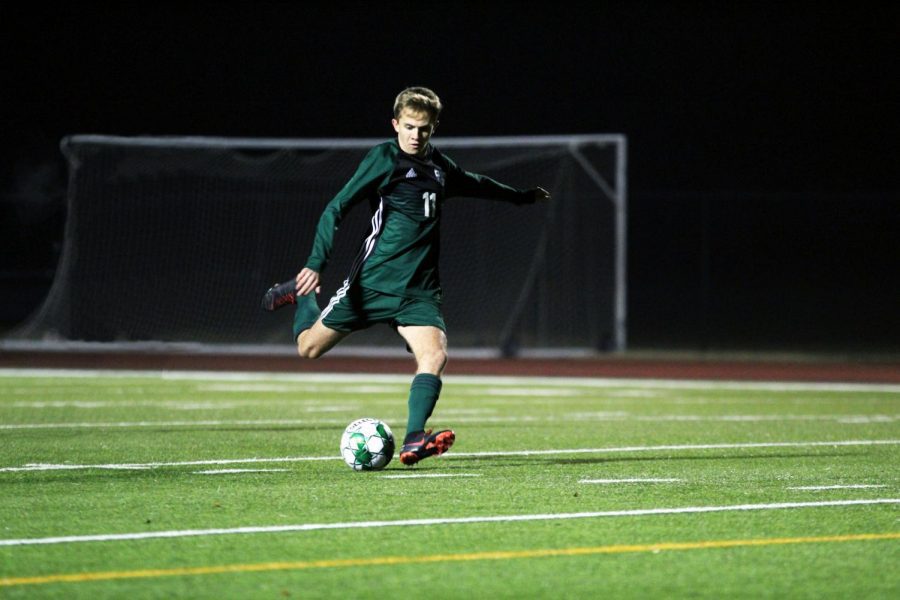 Senior Nathan Smith, No. 11, steps up for a penalty kick. The Eagles won their first scrimmage of the season against Irving Nimitz last Friday 3-1. They will scrimmage tonight against Hebron at 7:30. 