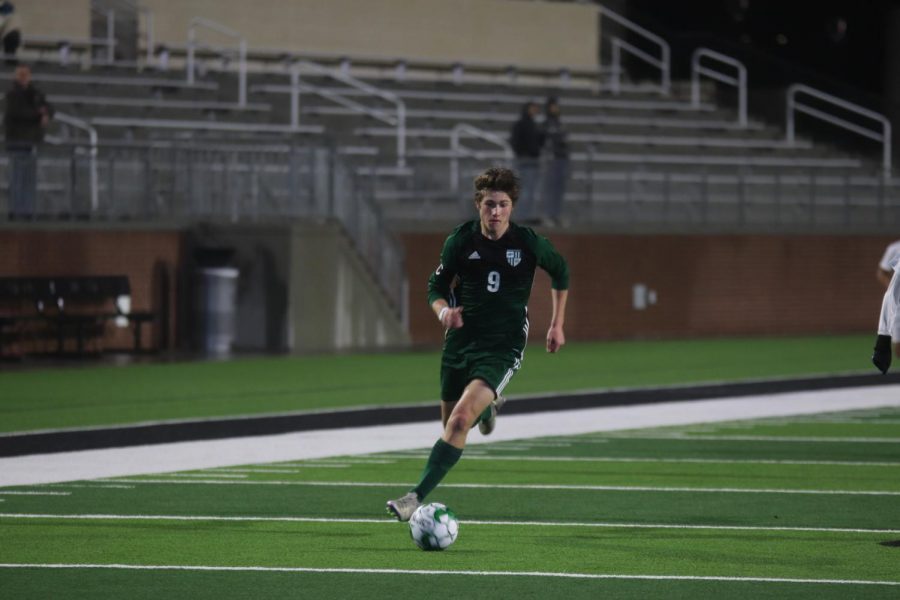 Senior captain Jack Simonini leads the ball downfield. The Eagles are went 4-3-1 in pre-season. They kickoff district play against McKinney High Tuesday, Jan. 21 at 7:30 p.m.