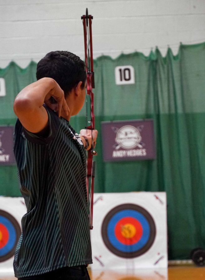 In the first scoring round of the Prosper Games, sophomore Sam Sidhu follows through and reflects on one out of the five arrows at the 10-meter mark. Sidhu placed seventh in the high school boys division. The Archery Team hosted the Prosper Games this past weekend and shot very well, head archery coach Spaur said. The team finished the tournament in second place, behind the defending state champions.