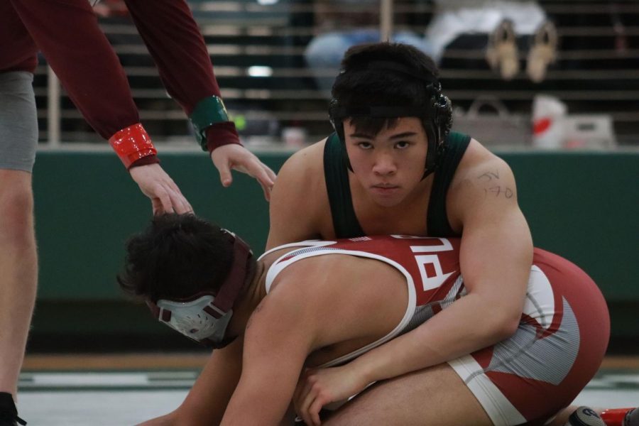 Sophomore+Lorenzo+Bacordo%2C+who+eventually+wins+this+match%2C+works+to+pin+his+opponent+at+the+District+6%2C+6A+tournament.+Prospers+junior+varsity+team+wrestled+today%2C+Feb.+5%2C+and+the+varsity+boys+and+girls+team+will+wrestle+tomorrow%2C+Feb.+6.+Winning+makes+me+feel+accomplished%2C+Bacordo+said.+You+work+so+hard+to+win%2C+and+its+so+worth+it+when+you+get+your+hand+raised+at+the+end+of+a+match.