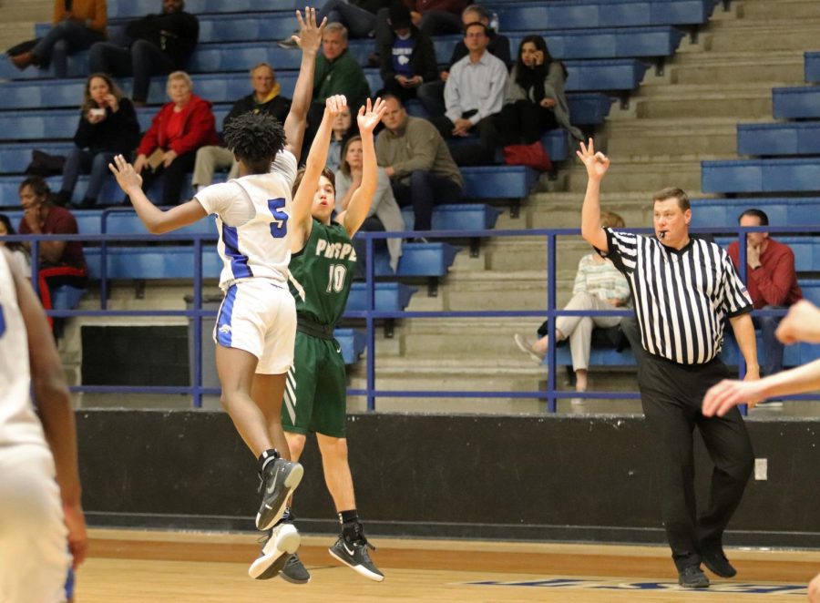 JV player Cooper Boushey shoots a three-pointer. The JV Eagles won 57-53 against Plano West. Both JV and varsity will play Allen on Friday, Feb. 7. 