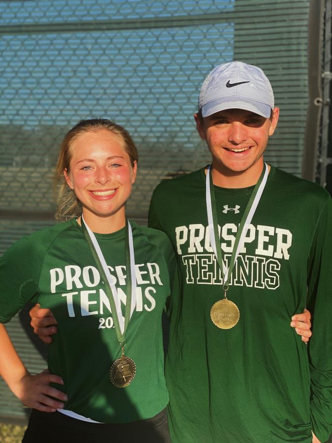 Sophomore Madi Hise and junior Jett Anderson smile after winning first place in the Prosper Invitational. The duo had to beat 4 teams in order to win first place. We worked together as a team, Anderson said. When you come together as a team everything is possible. 
