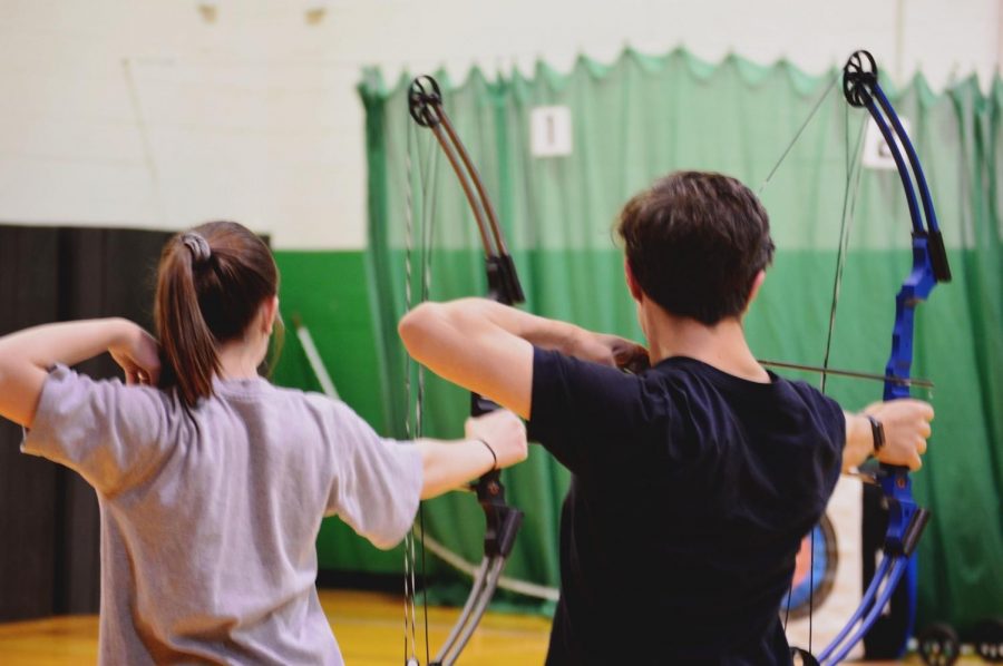 Sophomore Jessica Hampton and Freshman Sean Rich, set up their shots and aim for their targets. Both archery teams practice two nights a week in preparation for upcoming tournaments. I like how it is a sport anyone can do, Hampton said.
