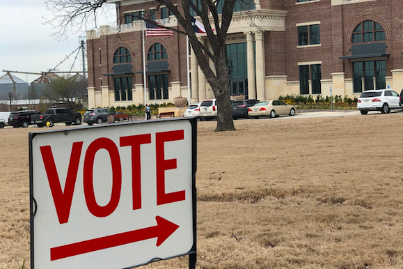 A vote sign sits outside of Prosper Town Hall. The town hall is the only polling place in Prosper to vote for the primary election. Polling centers are open from 7 a.m. to 7 p.m. 