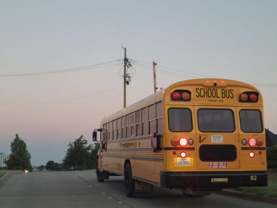  A Prosper Independent School District  pauses before crossing the railroad tracks around 7 a.m. this morning, Aug. 18, at Prosper Trail. Amidst the COVID-19 pandemic, PISD has made new regulations for  school buses. One of the major changes requires students to wear masks, and requires social distancing.