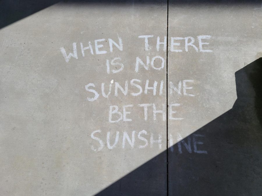 Motivational phrases mark the sidewalk in front of the school auditorium entrance. Last week, Hope Squad decorated the concrete in colorful chalk for students entering the building to see. This is the organizations second year at Prosper High School.