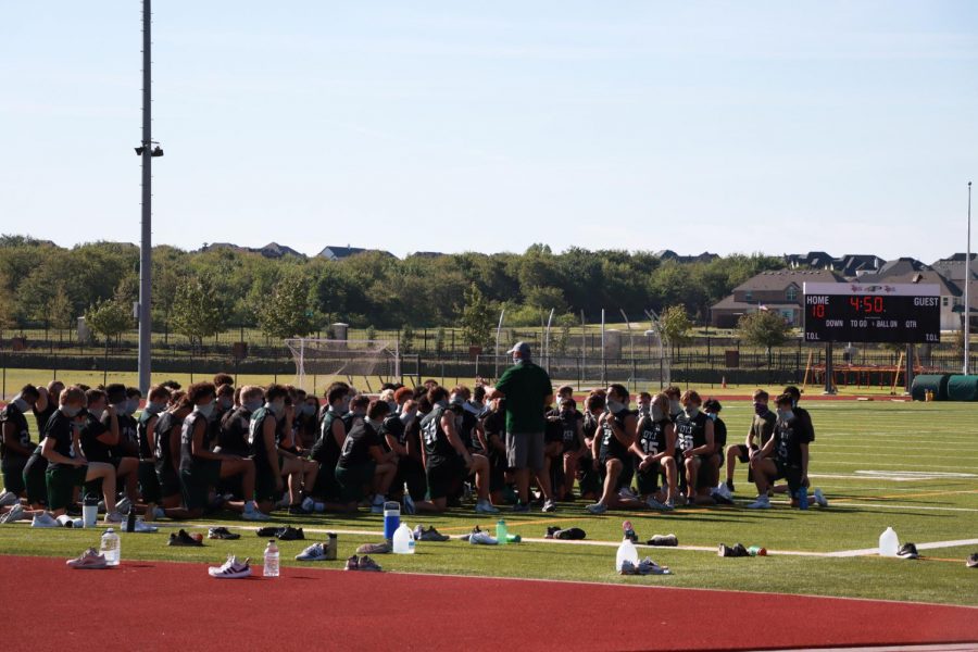Football players kneel at the end of practice while their coach talks. The Big 10 and Pac-12 conferences announced their football season will be cancelled for the 2020 fall season. After scrambling for weeks to get things in order, it was obvious cancelling was the best decision for the conference.