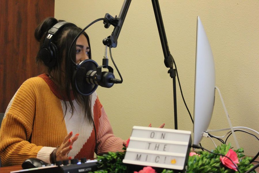 Senior Emily Reish speaks into the microphone of the podcast equipment. This year, Eagle Nation Online will feature her podcast, "On the Mic." Due to COVID-19 adjustments, podcasts may include call-in interviews over the phone rather than in-person meetings to limit exposure and promote safety.