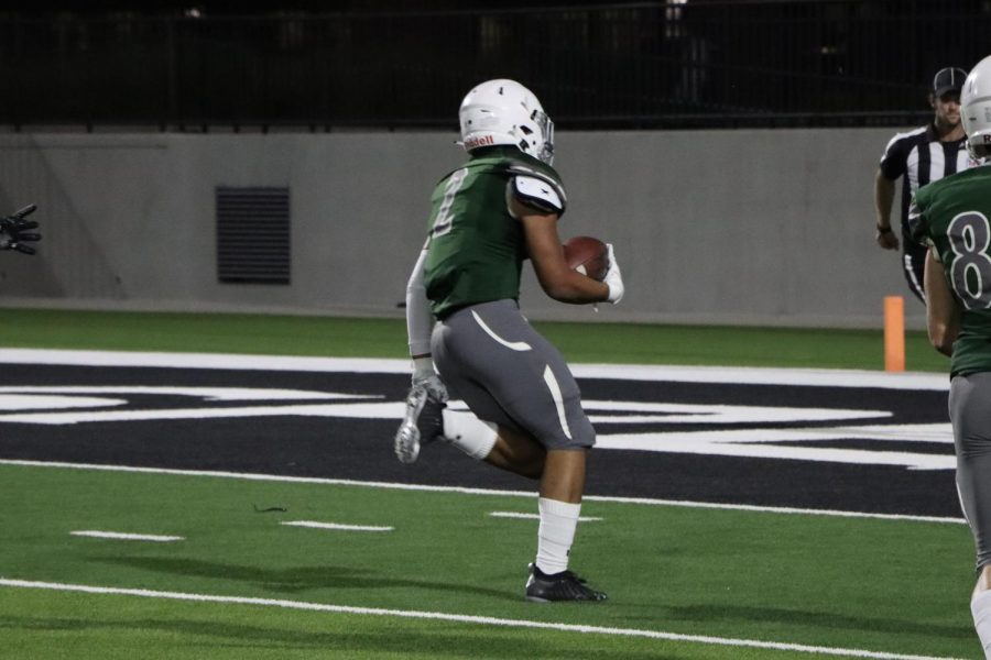 Rushing towards the endzone, sophomore running back Malik Daily carries the ball for an Eagle touchdown. He successfully made it to the endzone, scoring the third touchdown of the game. The junior varisty green team won 45-8 against the Euless Trinity Trojains.