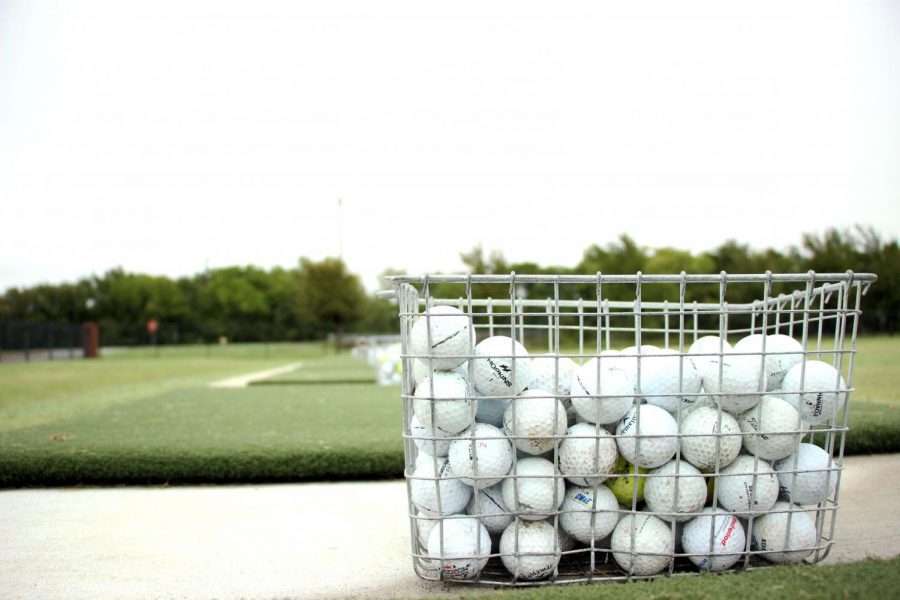 One in a series of golf baskets sits lined up along the high school golf range. The golf team competed at the Frisco Lakes Golf Club Sept. 21. I dont think we played the way that we would have liked in the first tournament, head golf coach Ryan Salinas said. It just showed that we can compete with the best competition in the state this year even when we dont have our best.
