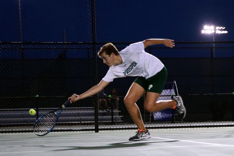 Reaching to secure a point during his match, sophomore Cameron Youtsey takes his racquet to the ground and lunges for the ball. The tennis team played its first series of matches against Plano East Tuesday, Sept. 8, on the home courts. I had so much fun, Youtzey said, and felt like I was on fire. 