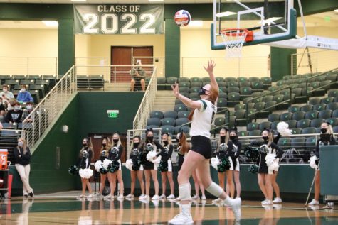 In a game from last years season, now-junior Ella Chaney prepares to serve the ball over in a winning game versus Braswell. Chaney and the Prosper Eagles have a current season score at 19-7. District play will start this Friday, Sept. 10, at home against Little Elm.
