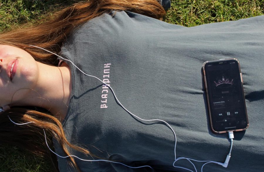 Laying in the grass, sophomore Gianna Galante listens to Blackpink. Lovesick Girls, Blackpinks title track, is a staple feature on their new album. I really enjoyed this album, Galante said. Its so different from their regular stuff, which makes it so good. 