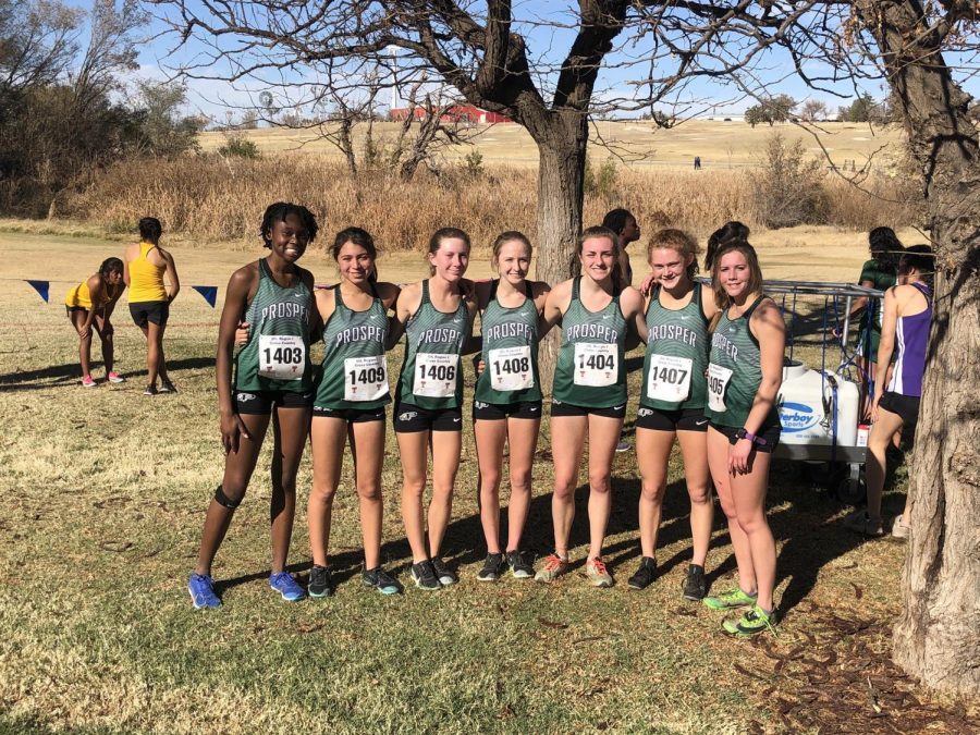 Squinting in the sunlight, the cross country girls team get together before their region competition. Out of 136 girls, Aubrey OConnell finished 2nd, Kate Parsons 34th, Caitlyn Kennedy 36th, Ava Kirkendall 37th, Emily Kern 44th, Carissa Reyes 83rd, and Abishai Aryee 100th. The three alternates were Mady Clements, Rylee Gleich and Emily Erb.