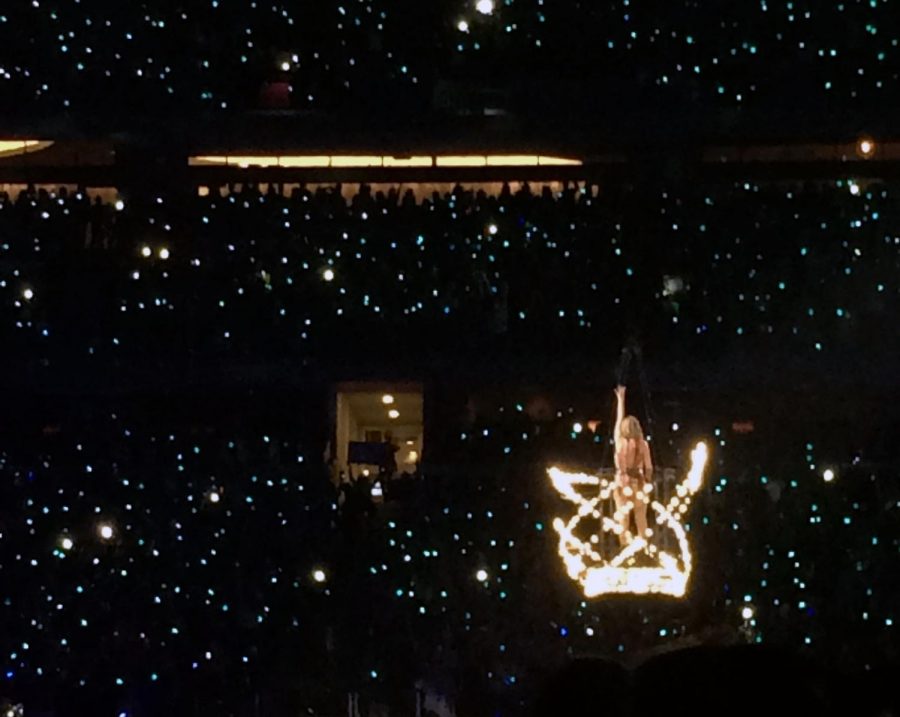 Standing on a platform above the crowd, Taylor Swift performs her song Delicate for her Oct. 6, 2018, Reputation tour concert in the AT&T Stadium in Dallas. Since her Reputation tour, Swift has released three albums, including Folklore in July and Evermore last week. Evermore is an excellent album and one of Swifts best, reporter Amanda Hare said in the attached album review. Swift really shines with her songwriting skills and vocals, proving that she can continue to make it in the indie-folk genre, despite how far it is from her former country or pop genres.