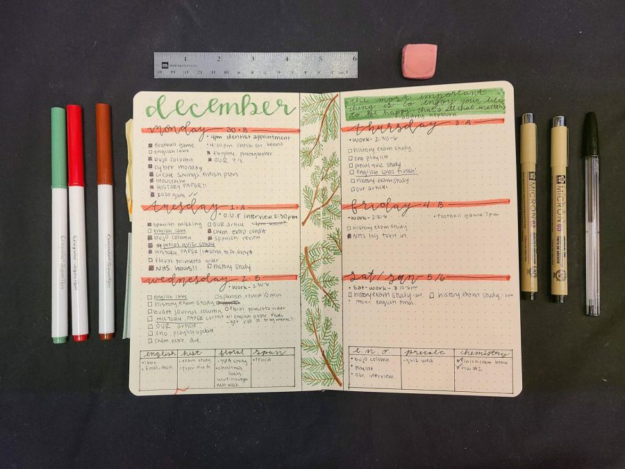 After+laying+out+her+supplies%2C+junior+Christi+Norris+prepares+to+work+on+her+bullet+journal.+Norris+has+bullet+journaled+since+February+of+her+freshman+year.+Bullet+journaling+has+allowed+me+to+stay+organized+with+my+school+assignments.+Norris+said.+It+has+also+helped+me+improve+my+grades+by+writing+all+of+my+due+dates+and+assignments+down.