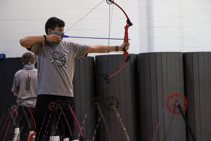 As he lines up the shot, junior Sam Sidhu steadies his bow. Sidhu competed in the national competition during his freshman year, but his sophomore year nationals were cancelled due to COVID-19. I enjoy archery, and I keep trying to get better every practice, Sidhu said. I hope the rest of our season continues normally.