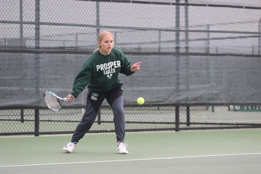 As she prepares to hit a forehand, senior Brooke Hallauer keeps her eye on the ball. The team played in the Rock Hill Invitational tournament and competed against teams from the surrounding areas. Next week, the team competes in the McKinney two-day tournament Feb. 12-13.