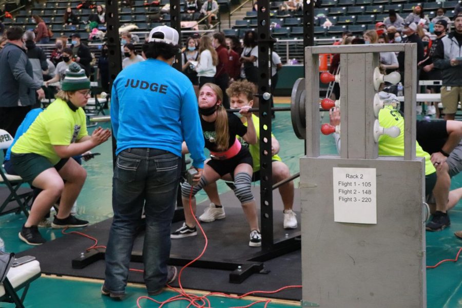 As the judge watches her closely, Sydney DuVall squats at the regional meet. DuVall placed fourth in the meet March 4. The girls powerlifting team placed sixth overall and third in the 6A regional championship.