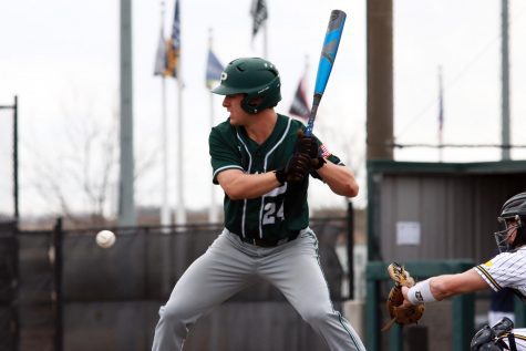 Waiting for the ball, junior Jacob Devenney prepares to swing his bat. Devenney is a two sport athlete, playing on both varsity baseball and football. Devenney has committed to play baseball at Rice University in the fall of 2022 after he graduates from Prosper.