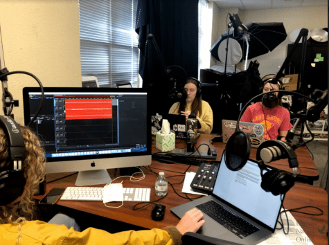 In an image taken by journalism advisor, Lisa Roskens, seniors Caroline Wilburn, Emma Hutchinson, and junior Christi Norris record the latest episode of Historys Forgotten. In this episode, the team discusses the history of Earth Day, held on April 22. Started in 1970, Earth Day began as a way to educate students about the planet. 