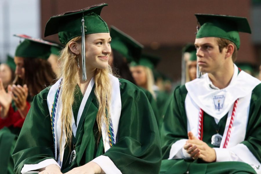 Head turned, senior Madelyn Moats smiles at the student beside her. Moats graduated in the top ten percent of her class. While at Prosper High School, Moats was a journalist for Eagle Nation Online, writing several articles and co-hosting a history podcast titled Historys Forgotten. 