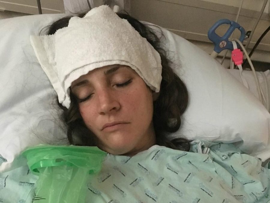 Eyes closed, art teacher Janette Church lies in a hospital bed after brain surgery. Church underwent brain surgery on Tuesday, March 19, 2019, after having a stroke. The surgery reestablish blood flow to her left brain.