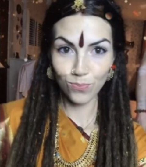Kundalini Yogini, a white woman, boasts a TikTok account centered around explaining Hinduism and teaching it. She wears traditional Indian cultural and religious attire and also wears dreads. She also claims the traditional Hindu religion has been destroyed and she is simply reviving it, despite Indian people telling her what shes doing is offensive.