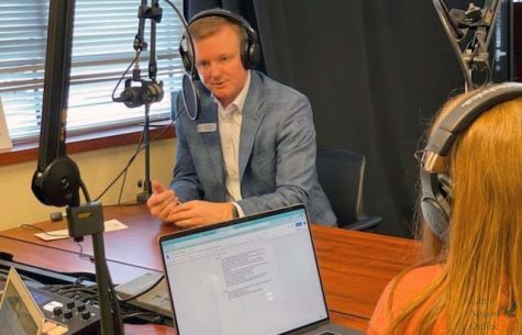 Seniors Amanda Hare and Morgan Reese interview district attorney Jeff Crownover. Crownover first work as a teacher, but then went back to law school. He now combines his love for education and the law as he works for the district.