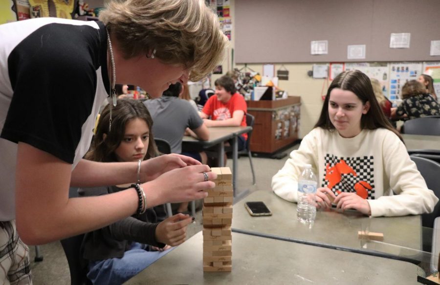 Placing his block on top of the stack, junior Tate Lauby plays Jenga with sophomore Rachel Jackson and senior officer Marlee Parrish. Lauby plays the perfume maker in the fall show Kodachrome, which will open on Oct. 14. As a cast member for Kodachrome, Im super excited for the show, Lauby said. Weve been working so hard to prepare for it to be great. Im extremely ready to get on the stage and preform once again.