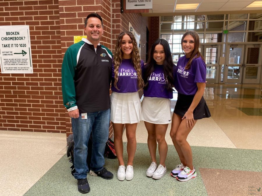 Seniors and varsity cheerleaders Evan McDonald,Amanda Vilello and Isabelle Lawless wear their Makayla Noble Hope Squad shirts while getting a photo with principal John Burdett. In the second episode of the podcast series CK-1, senior Caitlyn Kennedy and Burdett cover important topics such as Makayla Nobles story. Other topics discussed in the podcast are ways that students and staff can make a difference through fundraising. 