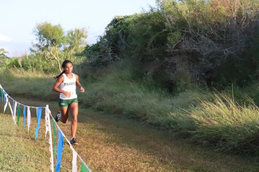 Staying strong, cross country runner, junior Shewaye Johnson  keeps up her endurance as she runs through the open field. On October 25th, 2021 Johnson competed at the UIL 6A 1 Championship Cross Country meet. Johnson placed 3rd overall, and Prosper placed 3rd for the womans cross country team overall. 