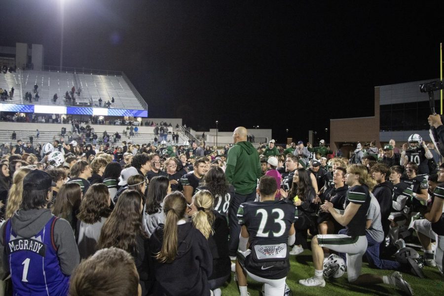 After the win against Allen, students, players and fans gather around head coach Schmidt. The game was played on Friday, Oct. 29 at 7 p.m. at Childrens Health Stadium. The final score was 28-23.